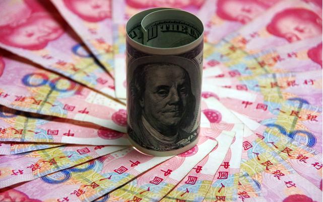 美元指數由跌轉升人民幣中間價報6.8395下調78點